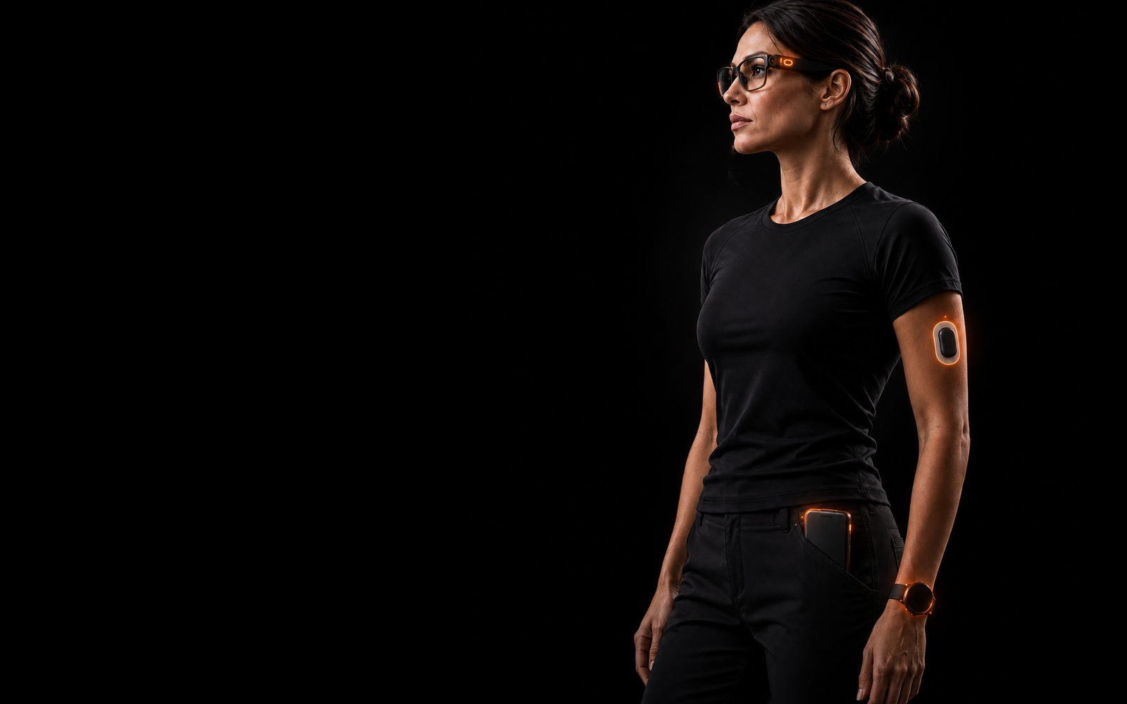 Woman wearing smart glasses, a wearable sensor, a watch, and a pocket compute device.